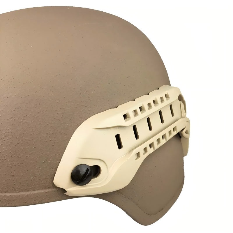 Close-up view of a tan MSA ARC helmet rail installed on a MICH helmet, showing the rail's attachment points and design details