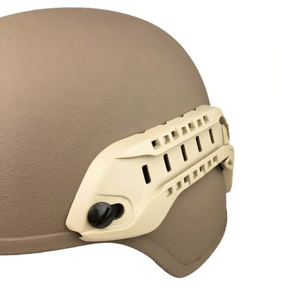 Close-up view of a tan MSA ARC helmet rail installed on a MICH helmet, showing the rail's attachment points and design details